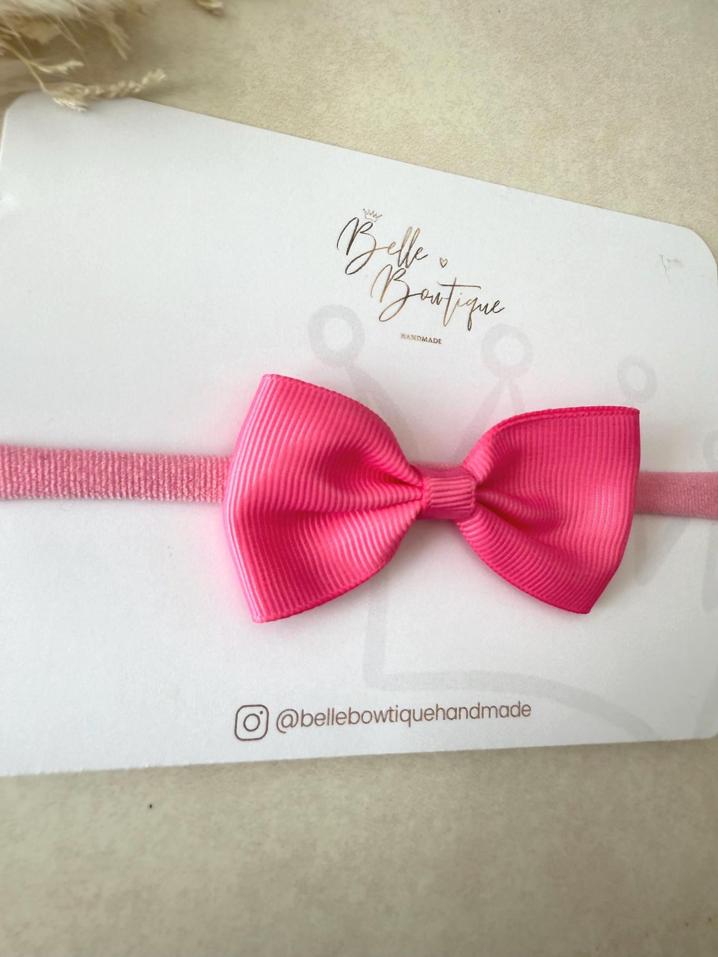 Pink Grosgrain ribbon bow headband on a nylon dainty headband for baby girl toddler and adult