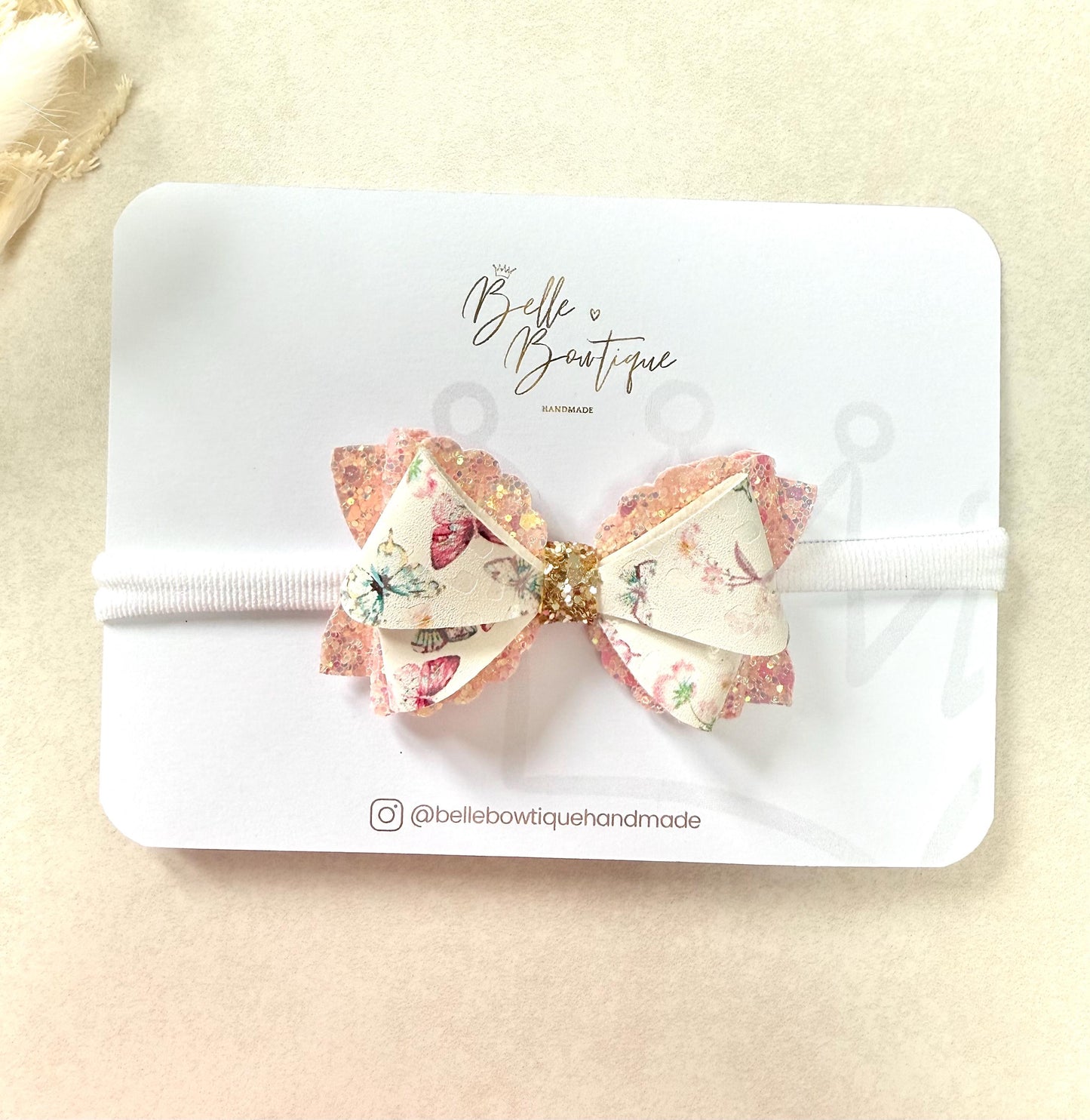 Pink butterfly baby headband on a soft nylon dainty headband for toddlers, babies up to adult