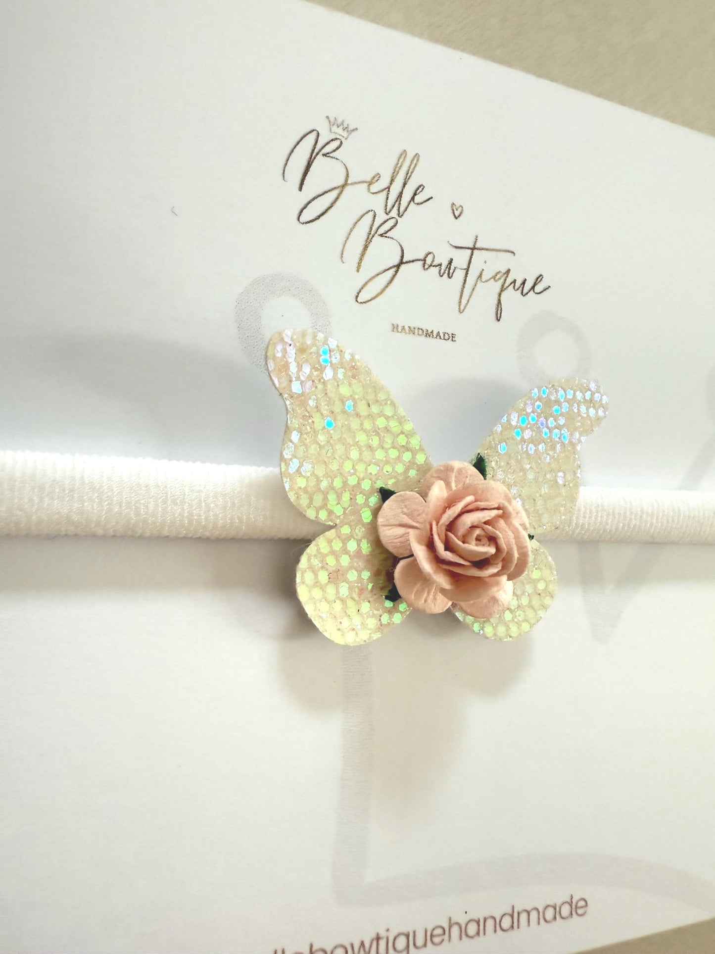 Pink and white butterfly baby headband on a soft nylon dainty headband for toddlers, babies up to adult