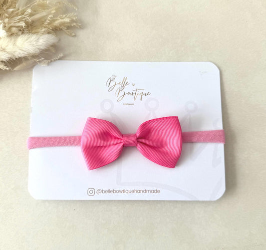 Pink Grosgrain ribbon bow headband on a nylon dainty headband for baby girl toddler and adult