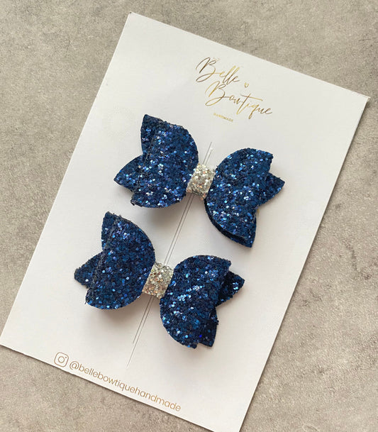 A Pair of Navy Blue and Silver Glitter Clips